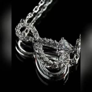 Swarovski Silver Swan Necklace with Infinity Design Suitable as a Birthday and Christmas Gift.