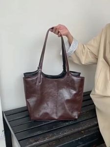 Cross-border niche womens bags 2025 Fashionable Commuting Cowhide Shoulder Bag Simple Lychee Pattern Crossbody Wing Bag