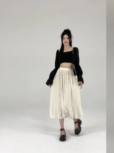 Ammin 2024 Mùa Xuân/Mùa Hè Mới nhăn Thiết kế váy xếp ly Váy phong cách hàn quốc nữ đàn hồi đàn hồi eo cao dọc A-line Chân váy ngắn thanh lịch