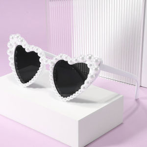 AU Heart-shaped frameless sunglasses with pearl embellishments fashionable for parties and gatherings with a unique and quirky design and in trendy candy colors