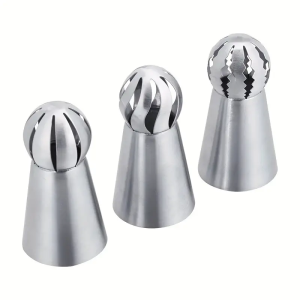 Stainless steel piping tips for cake decorating with three different nozzle designs creating pink green and mint green frosting patterns.