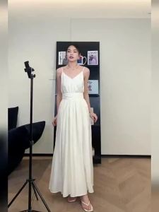 Dazzlin ชุดเดรสสายเดี่ยวสีแอปริคอทอ่อนหรูหราหรูหราระดับไฮเอนด์สำหรับสุภาพสตรีฤดูร้อน 2024 ชุดเดรสยาวสำหรับวันหยุดแบบใหม่เก็บเอวใส่แล้วดูผอม