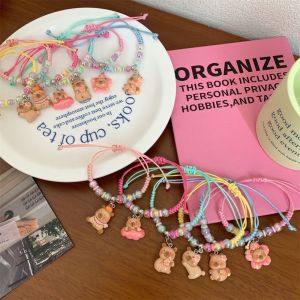 YOCKY หมีสำหรับเด็ก สร้อยข้อมือคาลิปบาร่า ของขวัญสำหรับเด็ก งานทำมือ สร้อยข้อมือลูกปัดถัก สร้างสรรค์และสร้างสรรค์ อุปกรณ์เครื่องประดับอัญมณี แหวนมือการ์ตูน นักเรียนก็อก