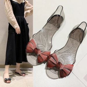 PRAYERF รองเท้าแตะ รองเท้าแตะเจลลี่ระยิบระยับ ป้องกันการลื่น รองเท้า รองเท้าส้นแบนผู้หญิง ป้องกันกลิ่น โปร่งใส รองเท้าแตะสไลด์ ฤดูร้อน