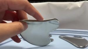 Dụng cụ làm săn chắc da mặt Gua Sha bằng thép không gỉ Massage làm đẹp Máy mát xa mặt có túi du lịch