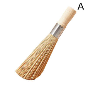 Bamboo wok brush with wooden handle and metal ferrule for cleaning woks.