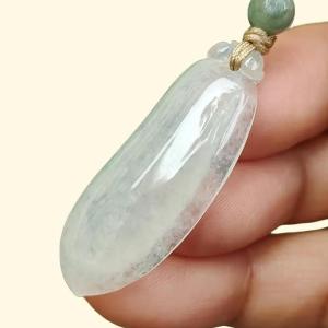 Icy Translucent Natural Burmese Jadeite Jade Crafted as Fuku Melon Pendant with light green hue certificate weighs 4.82 grams measurement 36.9 * 13.8 * 5.6 mm (pendant316)