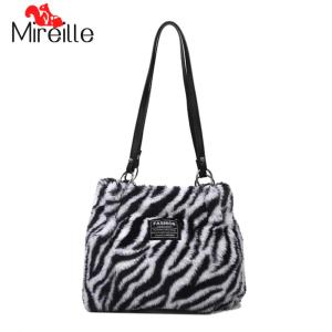 Mireille กระเป๋าถือขนกระเป๋าสะพายไหล่ฟูสำหรับผู้หญิงกระเป๋าสตางค์แบบมีสไตล์กระเป๋ากระเป๋าหนังสือขนฟูลายม้าลาย/วัว