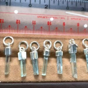 6200-GIÁ 1 CÂY TINH THỂ AQUAMARINE CHƯA QUA MÀI ( THIÊN NHIÊN) BỌC BẠC không kèm dây [ chọn 1-12] nhắn cho shop