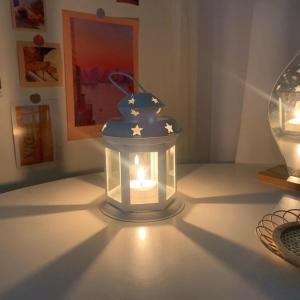 European classical candle holder metal windproof lamp candle holder hollowed out iron art glass wind lamp home decoration ornaments candle holder