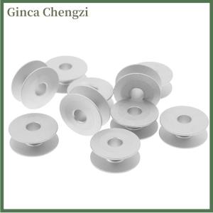 Ginca 10pcs 21mm อุตสาหกรรมอลูมิเนียม bobbins สำหรับนักร้อง Brother จักรเย็บผ้าเครื่องมือ
