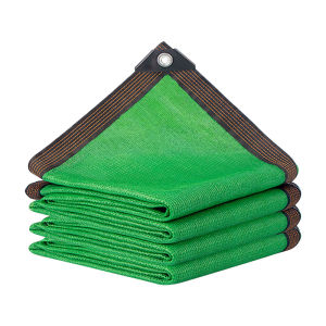 Green shading net for sun protection heat insulation and shading of succulents in courtyards rooftops and greenhouses with hemmed edges and perforations.