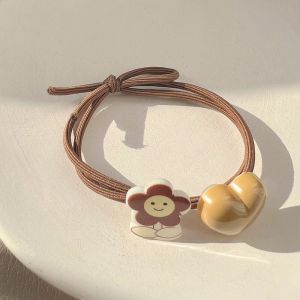 Dây cột tóc thun màu be và màu nâu đính trái tim kèm charm bông hoa gấu thỏ hoạt hình đáng yêu H86