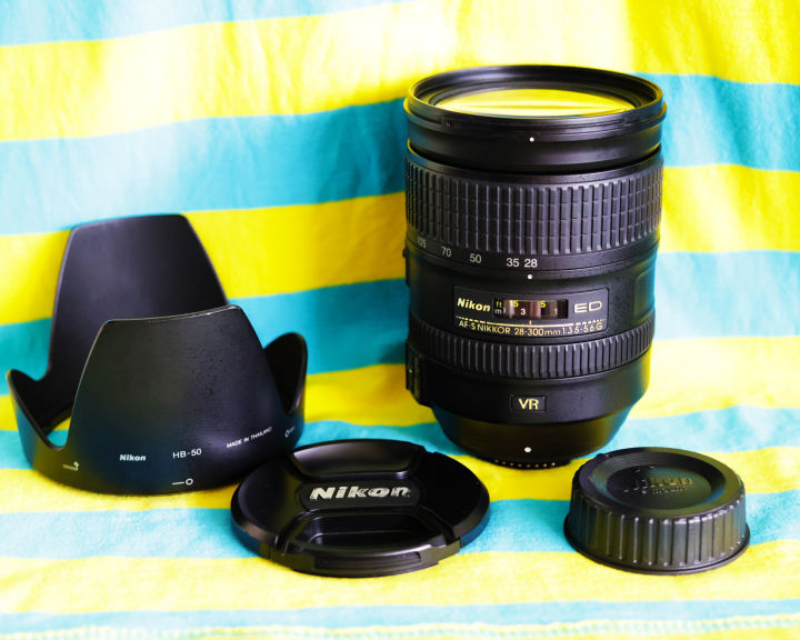 Nikon AF-S 28-300mm NIKKOR 28-300 มม. f3.5-5.6G ED VR  ได้รับการออกแบบมาโดยเฉพาะสำหรับกล้องรูปแบบ FX  เพื่อประสบการณ์การถ่ายภาพเทเลโฟโต้ที่ยากจะหาใครเทียบ ช่วงซูมที่สูงถึง 10.7  เท่าช่วยดึงสิ่งที่อยู่ไกลให้เข้ามาอยู่ใกล้ขึ้น และสามารถถ่ายทอดภาพถ่ายและว  ...