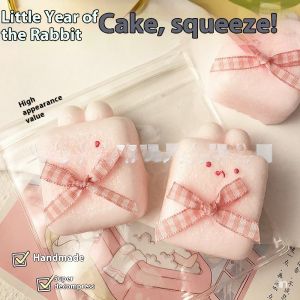 Deukio bắt chước Silicone siêu mềm Đồ chơi bóp hồng thỏ bánh gạo màu hồng đồ chơi xả stress dễ thương