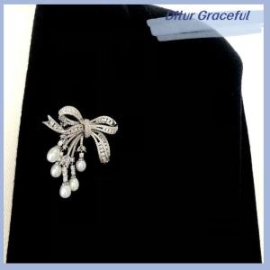 Ditur เข็มกลัดแฟชั่นประดับพู่รูปโบว์ไข่มุกเพทายสุดหรูสำหรับผู้หญิงชุดช่อดอกไม้ทำด้วยมือแบบสร้างสรรค์ของขวัญเสื้อผ้า