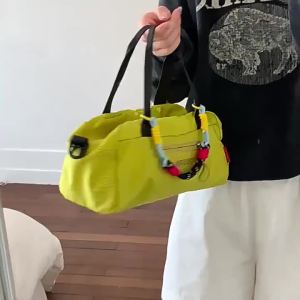 Lightweight bowling bag with a simple design and large capacity. This nylon shoulder bag features an adjustable strap and is a casual tote bag for women suitable for both indoor and outdoor use.