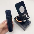 K98 mobile phone holder Bluetooth speaker power bank 3-in-1 multifunctional smart all-in-one machine with microphones. 