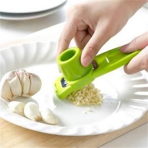 Garlic grater with removable hand cover