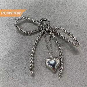 【PCWFKef】 พวงกุญแจรูปหัวใจติดโบว์น่ารักตามอารมณ์พวงกุญแจแฟชั่นประดับลูกปัดโทรศัพท์มีสายคล้องกระเป๋าสำหรับตกแต่งของขวัญ