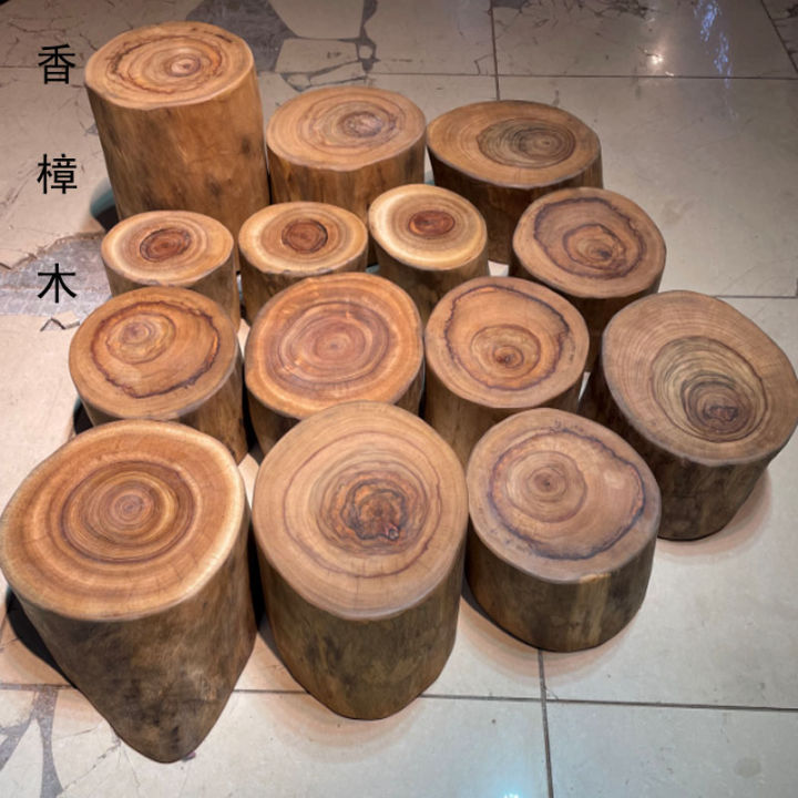 Solid wood stool root carving stool log stump pier root base wooden pier  wooden stool several small round stools beside the stake