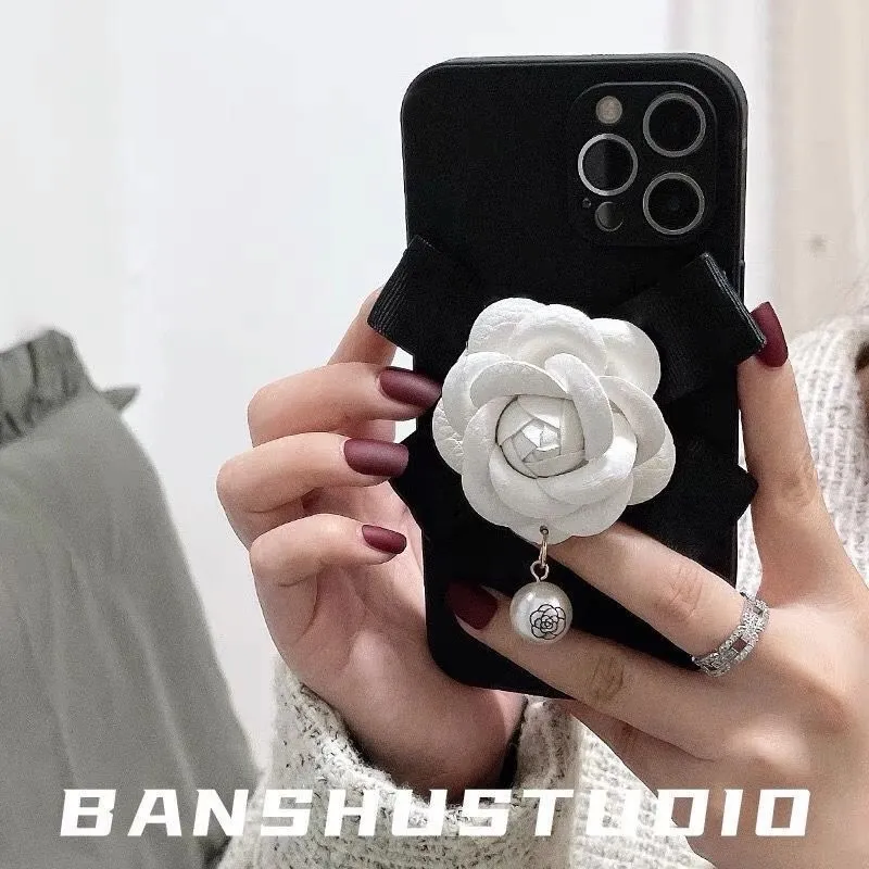 Chanel white rose flower pearl wristband phone case for iPhone 13