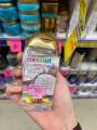 Tinh dầu dưỡng tóc OGX Coconut Miracle Oil.
