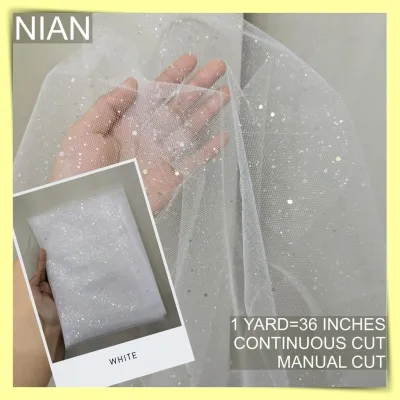 SILENKA GLITTERED FABRIC TULLE WITH FALLING GLITTERS PER YARD IS 36 INCHES LENGTH AND 60 FIXED WIDTH