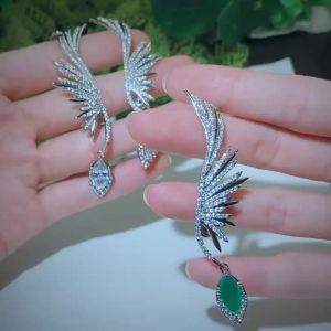 FCSEQUITO Unique Women White Gold Plated Jewelry Micro Paved Tiny AAA Cubic Zirconia Setting Green White Stone Vivid Symmetric Feather Evening Party Long Drop Earrings SE779