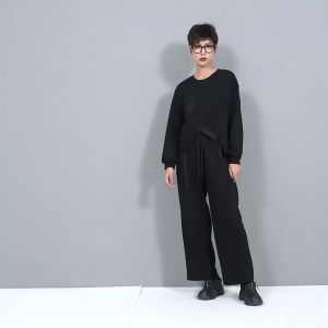 [EAM] Loose Fit Black Irregular Sweatshirt New Round Neck Long Sleeve Women Big Size Fashion Tide Spring Autumn 2026 1DF13212026