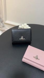 A compact three-fold wallet with a unique design suitable for holding coins and cards. Its a stylish womens wallet with a refined look.