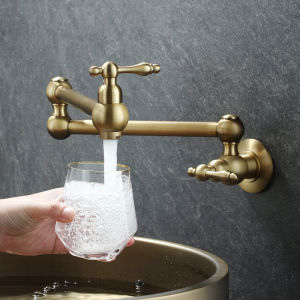 This wall-mounted folding kitchen sink faucet is crafted from solid brass its foldable design allows for extension and rotation making it easy to adjust the direction of the water flow.