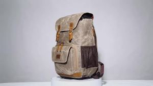 Durable waterproof camera backpack with a retro design suitable for both men and women includes a waterproof inner lining and a compartment designed for DSLR and digital cameras