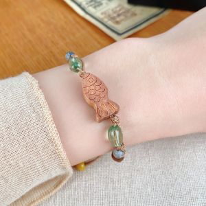 New Chinese style Chinese peach wood carving wooden fish koi bracelet retro handwoven hand rope niche design literature and art