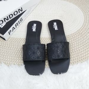 Brand: MiiMii Main product: Slide sandals Key attributes: Square toe Embossed pattern Flat sole Fit/use: Casual wear Easy slip-on Scene: Displayed on woven mat with books