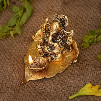 Lord Ganesha on Leaf with Diya Metal Idol | Ganesh Statue for Pooja Home Temple Diwali Decor & Return Gifts (Size - 12x10x7 cm | Pack of 1 Pc)