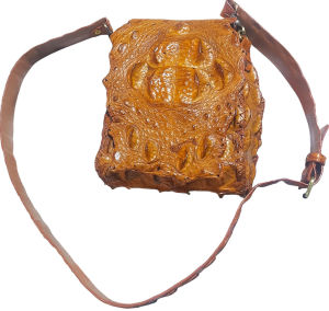 Popular shoulder bag bright tan color prominent hump and backbone