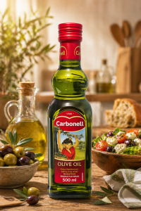 Carbonell Olive Oil 500 ml Extra Virgin Olive Oil with Mediterranean Flavors in a Green Glass Bottle with Red Cap Set on a Wooden Table with Olives Bread and Salad in a Kitchen Scene.