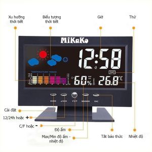 Đồng hồ thời tiết Mikako với màn hình kỹ thuật số hiển thị giờ ngày nhiệt độ độ ẩm và các biểu tượng thời tiết.