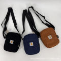 Carhartt Straddle Corduroy Vertical Crossbody Bag. 