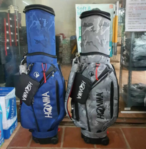 Túi đựng gậy golf Honma và Titleist cover cứng có bánh xe di chuyển dễ dàng khi đi máy bay an toàn và tiện lợi tặng kèm Cover che mưa túi gậy