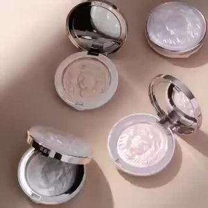 Highlighter for a radiant glowing complexion with a pearlescent shimmer and a contour palette featuring a pomegranate and ginger powder highlighter all under a private label.