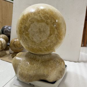 Cầu bi phong thủy đá tự nhiên đường kính 27cm màu vàng trong thấu ánh sáng cho mệnh Kim và Thổ (nặng 41kg) đá hiếm