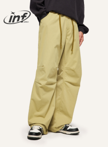 กางเกงพลร่มยืดได้สไตล์สตรีทแบบคลาสสิกอินเทรนด์2023ฤดูใบไม้ร่วง/ฤดูหนาวกางเกงขาตรงใหม่สำหรับทั้งผู้ชายและผู้หญิง