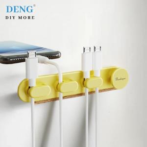 🎀🎁【Special price】Deng ฮับจัดสายชาร์จซิลิโคนอุปกรณ์แบบม้วนมีกาวในตัวอุปกรณ์จัดเก็บข้อมูลบนโต๊ะและที่ยึดอุปกรณ์แบบม้วนติดอยู่กับที่