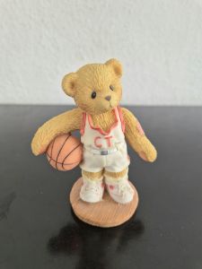Cherished Teddies with a rugby and a basketball