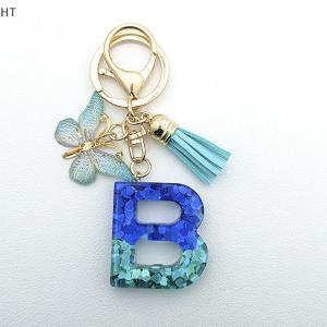 HT พวงกุญแจรูปผีเสื้อสีน้ำเงิน Y2k น่ารักใหม่1ชิ้นพวงกุญแจตัวอักษร26ตัวสำหรับกระเป๋าจี้ของขวัญสาวๆ