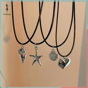 🔥ส่วนลด 10 บาท สำหรับการซื้อ 1 ชิ้น🔥ราคาถูก สร้อยคอจี้เปลือกหอยหัวใจเชือกสีดำแบบย้อนยุคสำหรับผู้หญิงสร้อยคอโซ่รูปปลาดาวสุดอินเทรนด์ของขวัญ