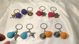 One Piece Anime Keychain Cartoon Devil Fruit Plush Backpack Pendant KeyChain Car Key Pendant Key Ring Luffy Accessories Gifts Anime Pirate Keychains for Women Men Metal Keychain Ace Law Cursed Devil Fruit Jewelry Pendant Keyring Choker Collares New