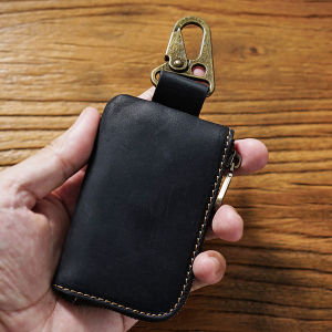 ยุโรปย้อนยุคกระเป๋าพวงกุญแจหนังแท้พวงกุญแจหูฟังบลูทูธยานยนต์เคสอัจฉริยะป้องกันกุญแจกระเป๋าใส่กุญแจและเหรียญสำหรับแม่บ้าน